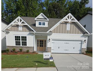 Charming new construction home with a two-car garage and nicely landscaped front yard at 9130 Dulwich Dr # Ken0079, Charlotte, NC 28215
