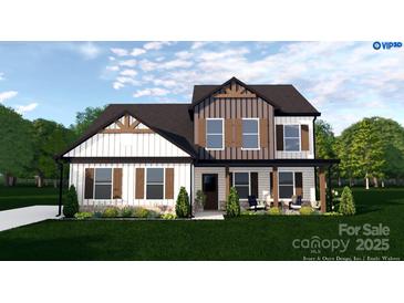 Charming two-story home with a covered porch and beautifully landscaped front yard for enhanced curb appeal at 4641 Yellow Poplar Ln, Concord, NC 28025