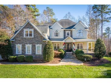 Two-story house with stone accents and a covered porch at 9267 Egret Rdg # 41, Belmont, NC 28012