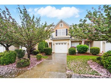 Charming two-story home with a well-maintained yard and beautiful flowering trees at 310 Rose Garden Ct, Rock Hill, SC 29732
