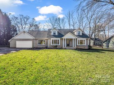 Charming brick home featuring well-manicured lawn, attached garage, and inviting entrance at 204 Jonas Dr, Lincolnton, NC 28092