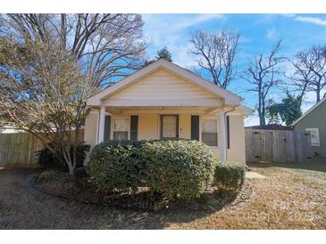 Cute bungalow with front porch and well-manicured landscaping at 128 Hugh Caldwell Rd, Charlotte, NC 28214