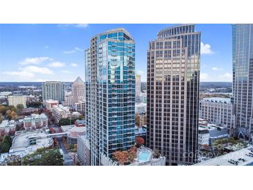 Stunning high-rise boasts modern architecture, a refreshing rooftop pool, and city views at 210 N Church St # 2702, Charlotte, NC 28202