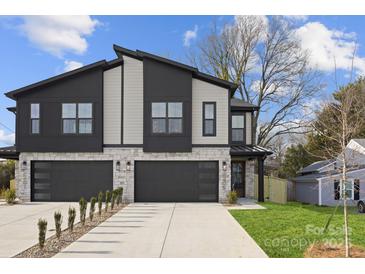 Modern three-unit building with stone and dark accents at 2205 Catalina Ave, Charlotte, NC 28206