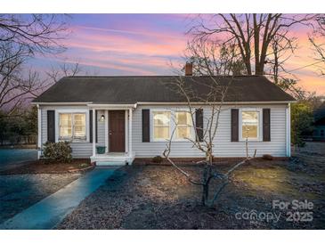 House exterior at dusk, showcasing its curb appeal at 317 W Main St, Marshville, NC 28103