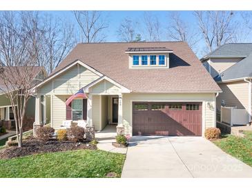 Craftsman style home with two-car garage and landscaped front yard at 136 Chimney Rock Ct, Denver, NC 28037