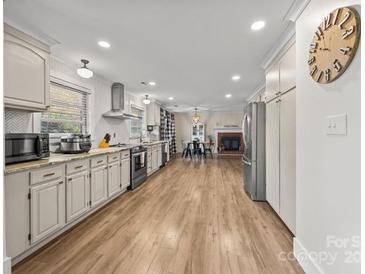 Bright kitchen with stainless steel appliances and light wood flooring at 955 Goodnight Rd, Salisbury, NC 28147