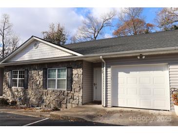 Charming condo featuring a stone facade, attached garage, and well-maintained landscaping at 194 E Jay Dr # 3, Taylorsville, NC 28681