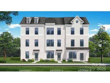 A bright, exterior elevation rendering of a modern townhome with a combination brick and siding facade at 5019 Layman Dr # 26, Charlotte, NC 28226