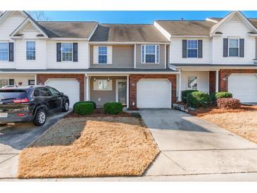 Charming townhouse with attached garage, well-maintained landscaping, and inviting curb appeal at 1305 Penny Oaks Cv, Rock Hill, SC 29732