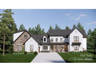 Striking two-story modern farmhouse with mixed siding and a welcoming covered front porch at 229A Ballard Ct, Fort Mill, SC 29715