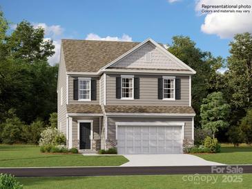 Two-story house with gray siding, two-car garage, and landscaping at 1808 Otter Perch Ln, Fort Mill, SC 29715
