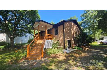 Charming brick home with a welcoming covered porch and a well-maintained front yard at 5315 Ruth Dr, Charlotte, NC 28215