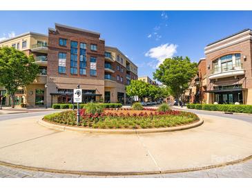 Attractive condo community with brick facade, balconies and landscaping in a vibrant community at 721 Governor Morrison St # 425, Charlotte, NC 28211
