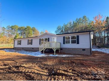 Charming single story home with light gray siding, black shutters, and a small entry deck at 3553 33Rd Street Ne Dr, Hickory, NC 28601