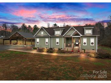 Charming craftsman-style home with inviting front porch and lush, landscaped yard at 170 Stillwater Rd, Richfield, NC 28137