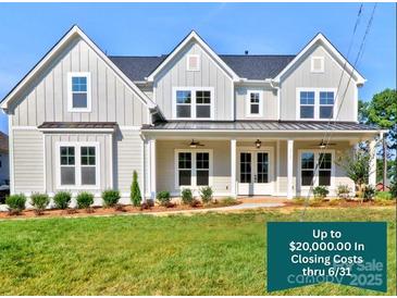 Charming two-story home with gray siding, black roof, and manicured front lawn showcasing closing cost promotion at 1875 Rock Hill Church Rd # 4, Matthews, NC 28104