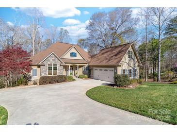 Stunning home with stone accents, well-manicured lawn, and inviting curb appeal at 404 Yorkfield Dr, Shelby, NC 28150