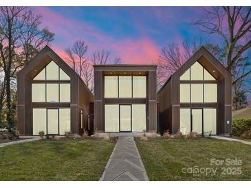 Stunning modern home featuring a unique architectural design and large windows at 4026 Chevington Rd # 103, Charlotte, NC 28226