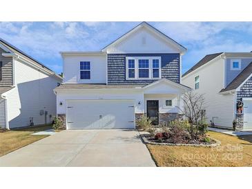 Two-story home with gray and white siding, stone accents, and a two-car garage at 5762 Soft Shell Dr, Lancaster, SC 29720