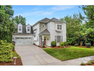 Two-story house with attached two-car garage and well-manicured lawn at 19830 Madison Village Dr # 65, Cornelius, NC 28031