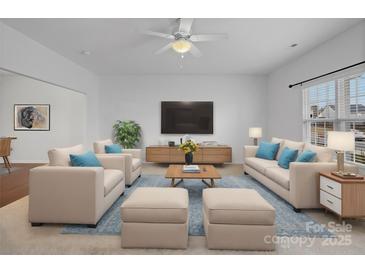 Spacious living room with neutral furniture and large TV at 2565 Meadow Crossing Dr, Dallas, NC 28034