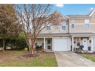 Charming townhome with a one-car garage and a cozy front porch and beautiful exterior finishes at 4609 Emily Pl, Rock Hill, SC 29732