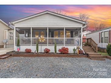 Charming single story home with screened porch and landscaped yard at 108 Elm St, New London, NC 28127