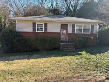 Brick and siding ranch home with well-maintained lawn at 112 Adcock St, Belmont, NC 28012