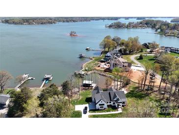 Stunning aerial view of waterfront home with private dock and scenic lake views at 5056 Bridge Way, Denver, NC 28037