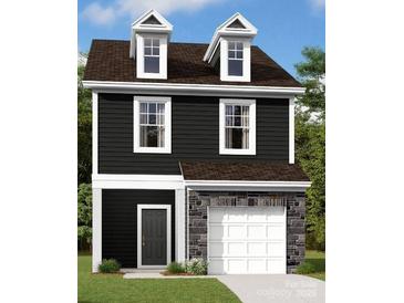 Two-story dark gray house with white accents, stone garage, and dormer windows at 4031 Lawnview Dr, Charlotte, NC 28269