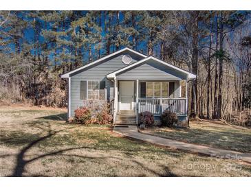 Charming single-story home with a cozy front porch and well-maintained landscaping at 588 Blossom Hill Rd, Lincolnton, NC 28092