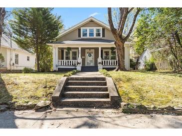 Charming craftsman-style home with a welcoming front porch and well-maintained landscaping at 507 W 2Nd Ave, Gastonia, NC 28052