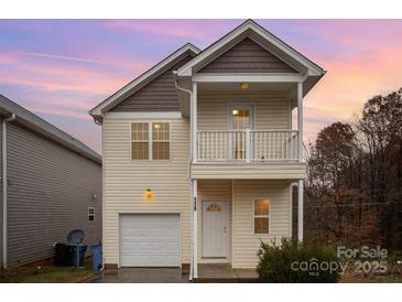 Two-story house with a neutral color scheme and a balcony at 119 Lookout Point Pl, Mooresville, NC 28115