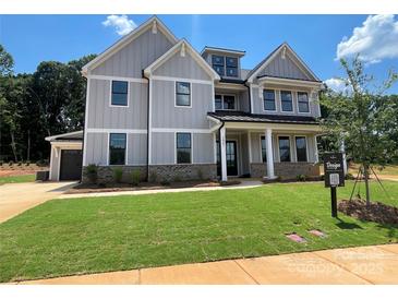 Beautifully designed new construction home with a well-manicured lawn and inviting curb appeal at 2007 Kendall Dr # 6, Wesley Chapel, NC 28173