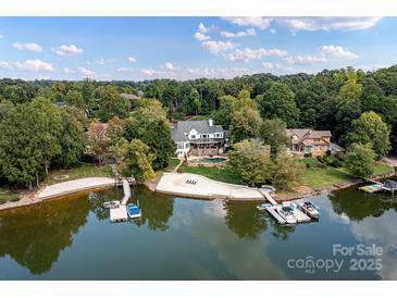 Luxury waterfront home with private beach, dock, and stunning lake views at 19100 Mary Ardrey Cir, Cornelius, NC 28031