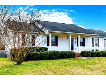 Charming single-story home with white siding, dark shutters, and a well-manicured front lawn, creating a welcoming curb appeal at 1976 Mcilwain Rd, Lancaster, SC 29720