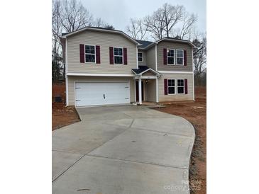 Two-story house with a two-car garage and burgundy shutters at 919 W Sumter St, Shelby, NC 28150