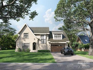 Charming two-story home with a brick facade, arched entryway, attached garage, and beautiful front yard at 3814 Topsfield Rd, Charlotte, NC 28211