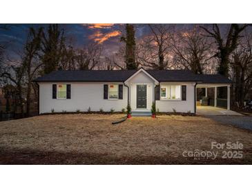 Charming white brick ranch house with a covered carport and well-manicured lawn at 1816 31St Ne St, Hickory, NC 28601