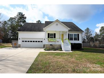 Charming one-story home with a white exterior, attached garage, and landscaped lawn at 1274 Bicycle Ct, York, SC 29745