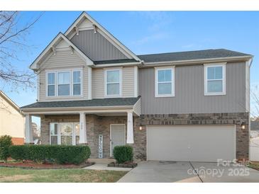 Two-story house with gray siding, brick accents, and a two-car garage at 188 Water Ski Dr, Statesville, NC 28677