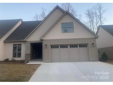 Charming home with a neutral color palette, complemented by stone accents and an attached two-car garage at 4033 Stadler Ne Dr # 22, Conover, NC 28613