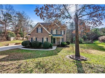 Brick house with a two-car garage and landscaping at 116 Diamond Head Dr, Mooresville, NC 28117