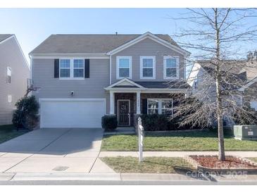 Two-story house with attached garage and front yard at 3960 Farmington Ridge Pkwy, Charlotte, NC 28213