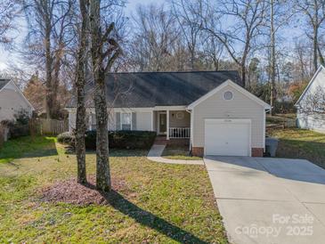 Charming single Gathering home with a one car garage and a well manicured front lawn at 5218 Haybridge Rd, Charlotte, NC 28269