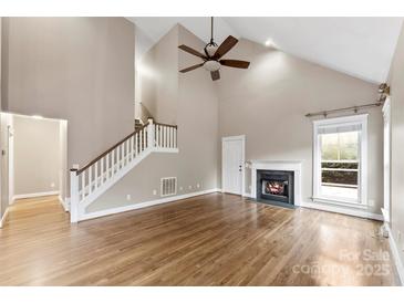 Bright living room with hardwood floors and fireplace at 7708 Spanish Oaks Dr, Waxhaw, NC 28173