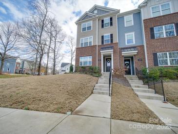 Attractive three-story townhome with landscaping at 12024 John Newton Dr # 41, Davidson, NC 28036