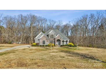 Brick house with a large front yard and driveway at 4006 Sincerity Rd, Monroe, NC 28110