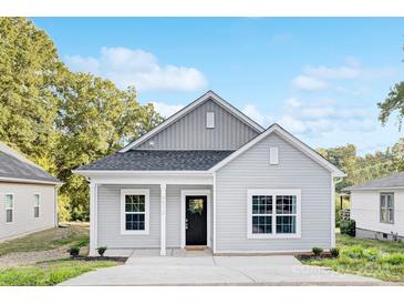 Charming gray house with a black door and a small porch at 5633 Torrence St, Charlotte, NC 28269